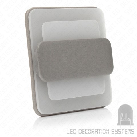 A contemporary LED light switch featuring layered surfaces with a sleek, minimalist aesthetic.